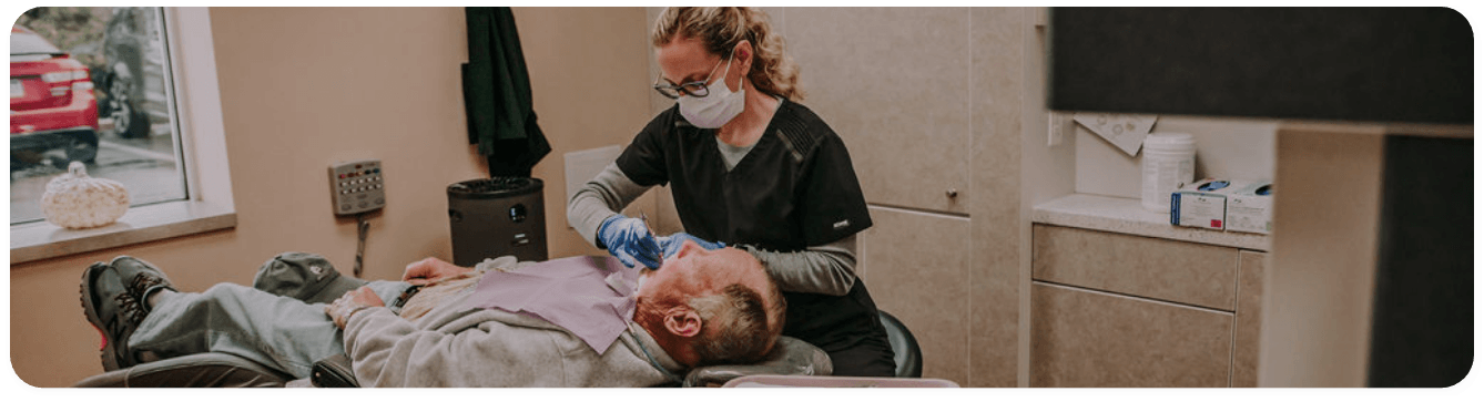 Dentist treating a patient with advanced dental technology in Washington
