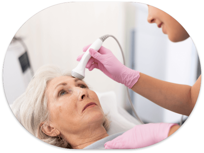 Older woman receiving laser wrinkle treatment from her dentist
