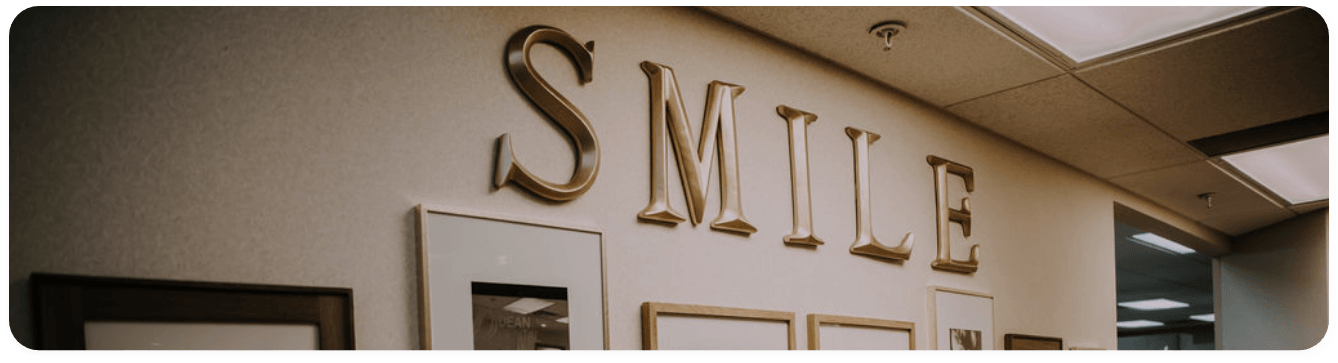 The word smile framed on wall of Washington dental office