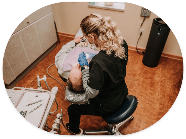 Cosmetic dentist treating a patient