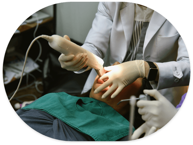 Dentist taking digital dental impressions of a patient