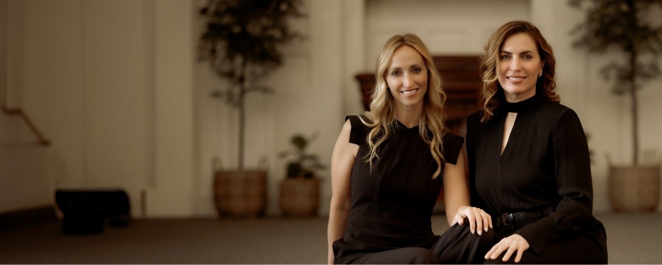 Two Washington Pennsylvania dentists smiling at each other