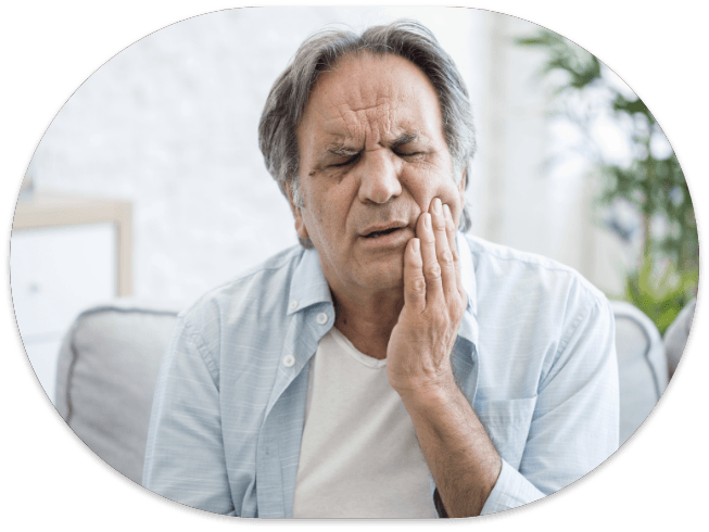 Man holding the side of his jaw in pain