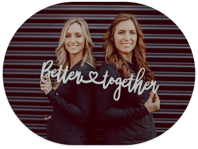 Doctor Stacy and Doctor Jessia holding sign that reads Better Together