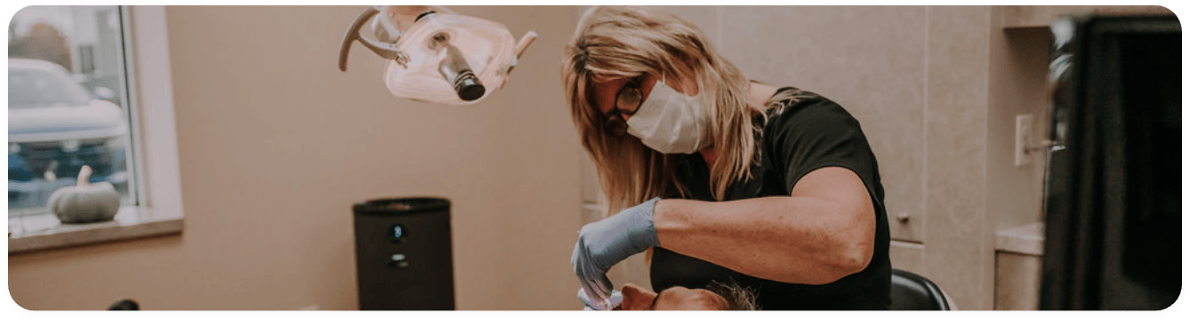 Dentist giving a patient a preventive dentistry checkup