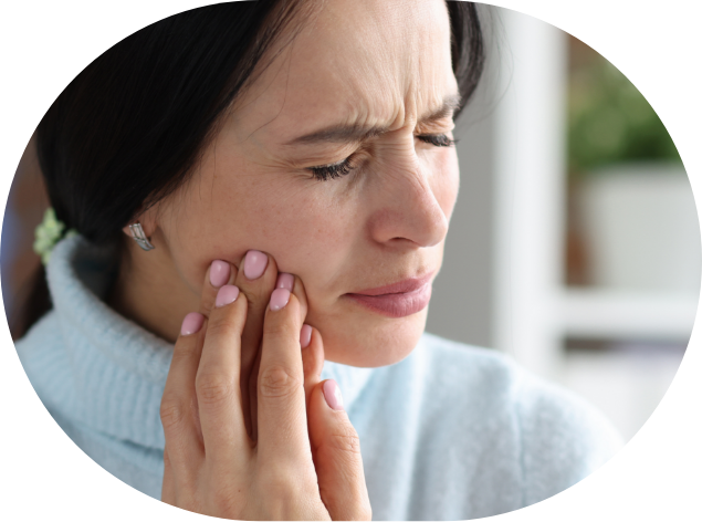 Woman holding her jaw in pain before T M J treatment in Washington